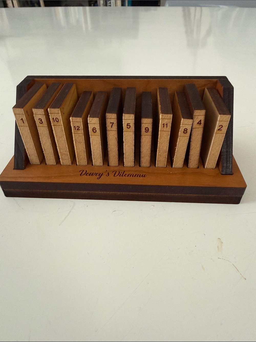 Wooden Dewey's Dilemma book title/ Number Puzzle - Brown